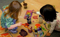 Our Research | Children painting together